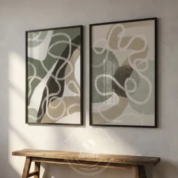 Modern bir salon duvarında siyah çerçeveler içinde asılı ikili soyut poster seti.